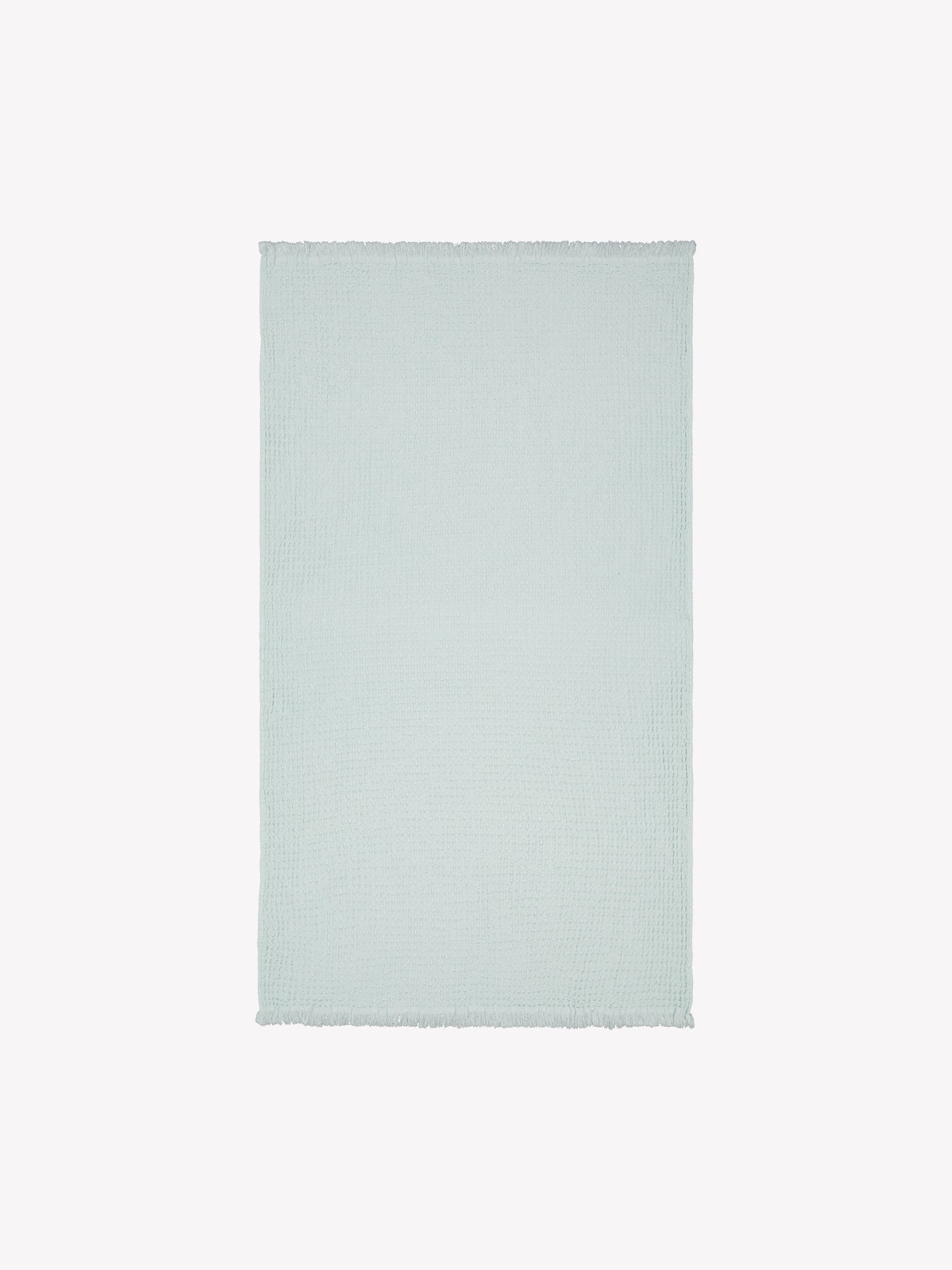 Nanson mintun sävyinen Vohveli-kylpypyyhe tuotekuvassa auki.