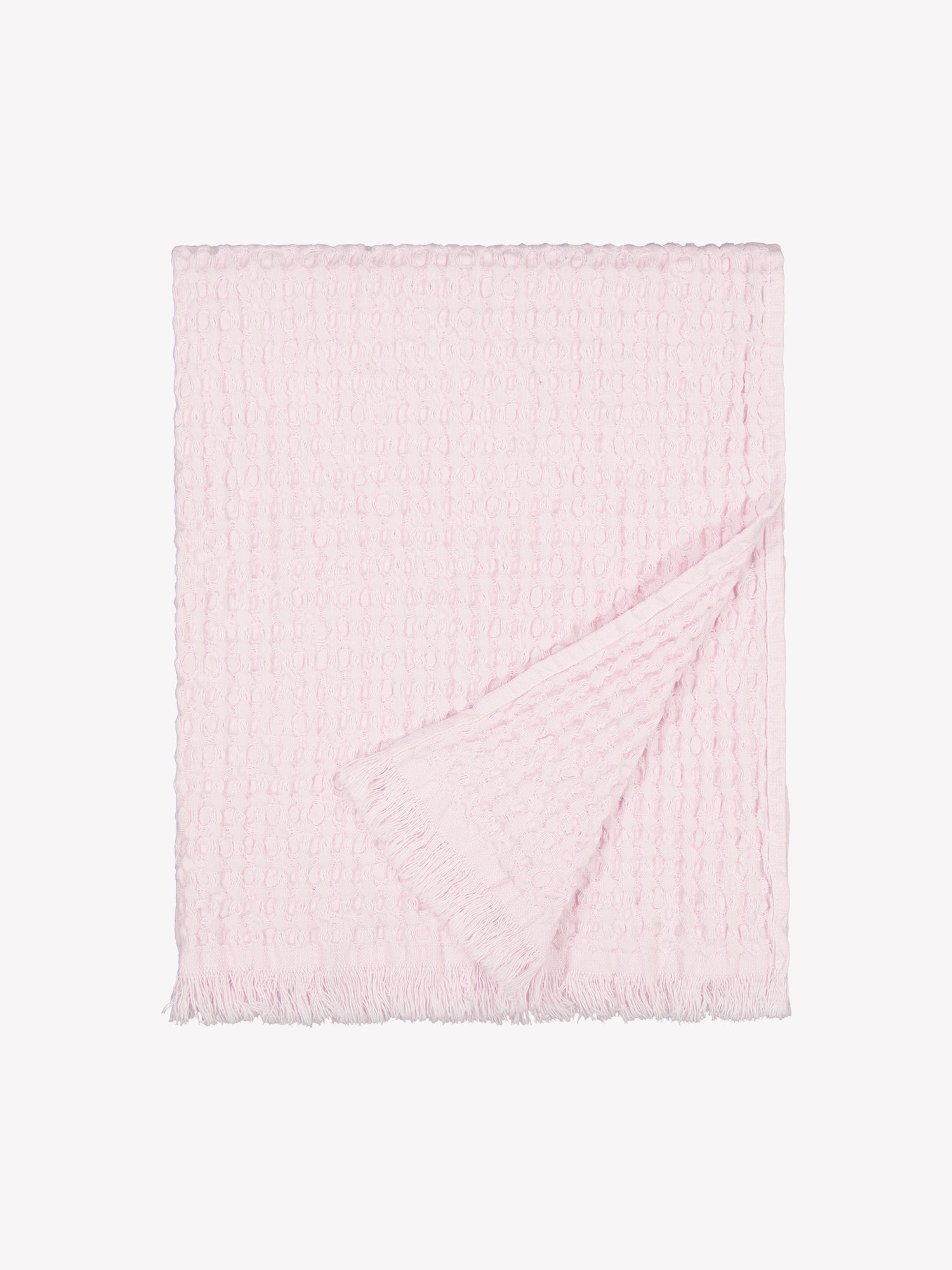 Nanson vaaleanpunainen Vohveli-käsipyyhe viikattuna tuotekuvassa.