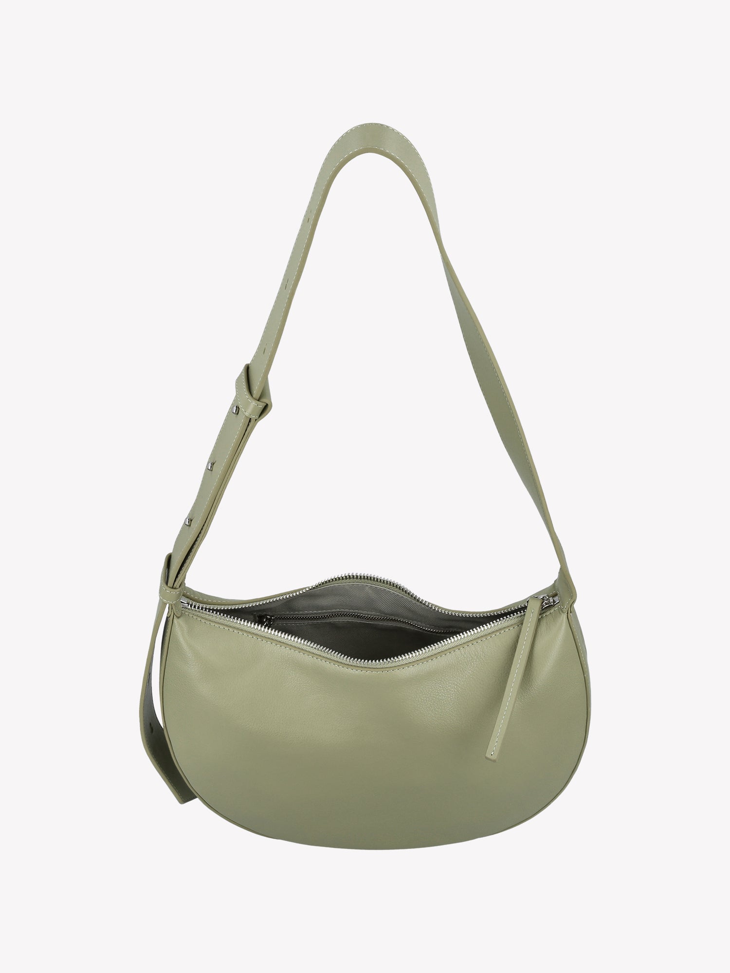 Tyylikäs ja trendikäs puolikuun mallinen vaaleanvihreä OLKA KUU - nahkalaukku. Laukussa on olalle sopiva kantohihna ja logo nahan pinnassa. Vuoritetussa laukussa on päällä metallinen vetoketju. Tuotekuva yläviistosta, niin että laukun sisälle näkee.