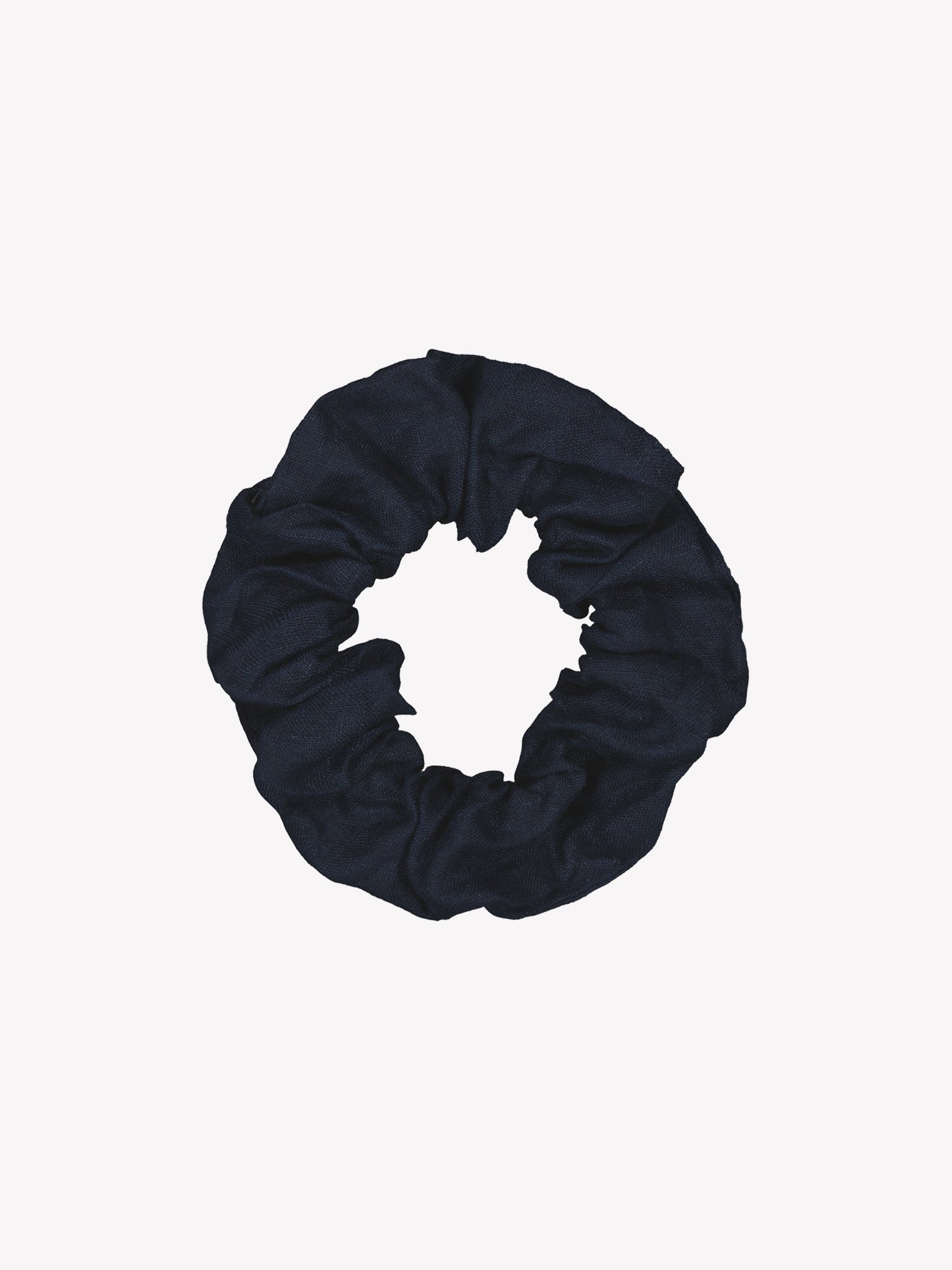 Kaunis ja ajaton tummansininen Pellava-hiusdonitsi tuotekuvassa.