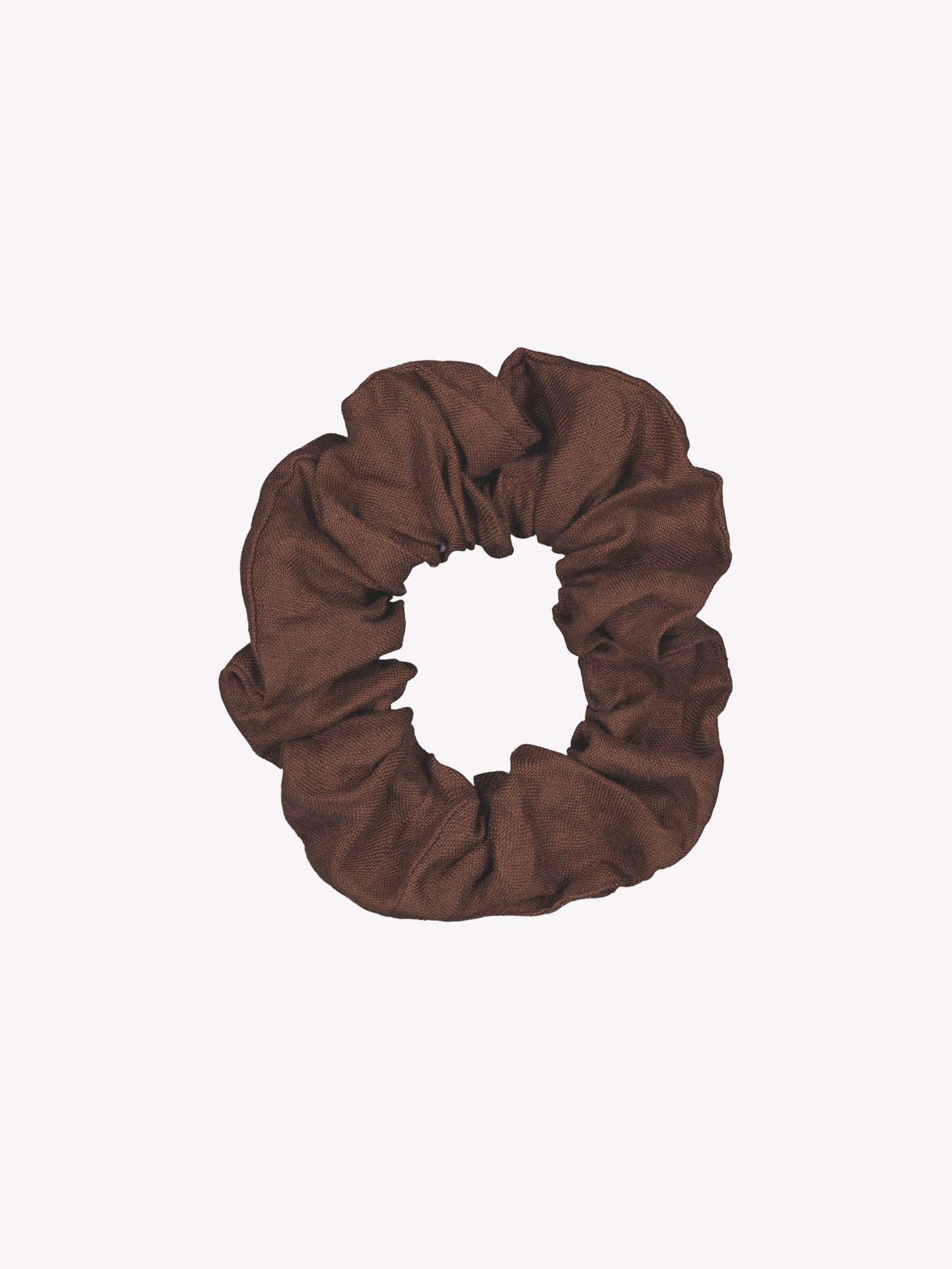 Kaunis ja ajaton ruskea Pellava-hiusdonitsi tuotekuvassa.