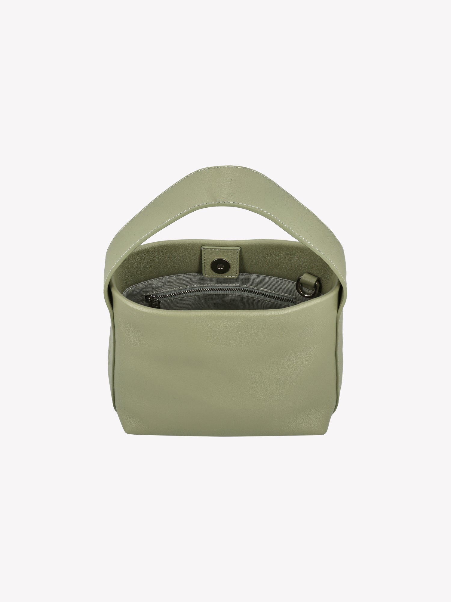 Nanson tyylikäs vaaleanvihreä MINI OLKA - nahkalaukku. Upea olkalaukku hurmaa arjessa monikäyttöisyydellään. Nahkalaukussa on sekä kantohihna että irrotettava ja säädettävä olkahihna. Tuotekuvassa ylhäältä viistosti, jotta laukun siälle näkee.