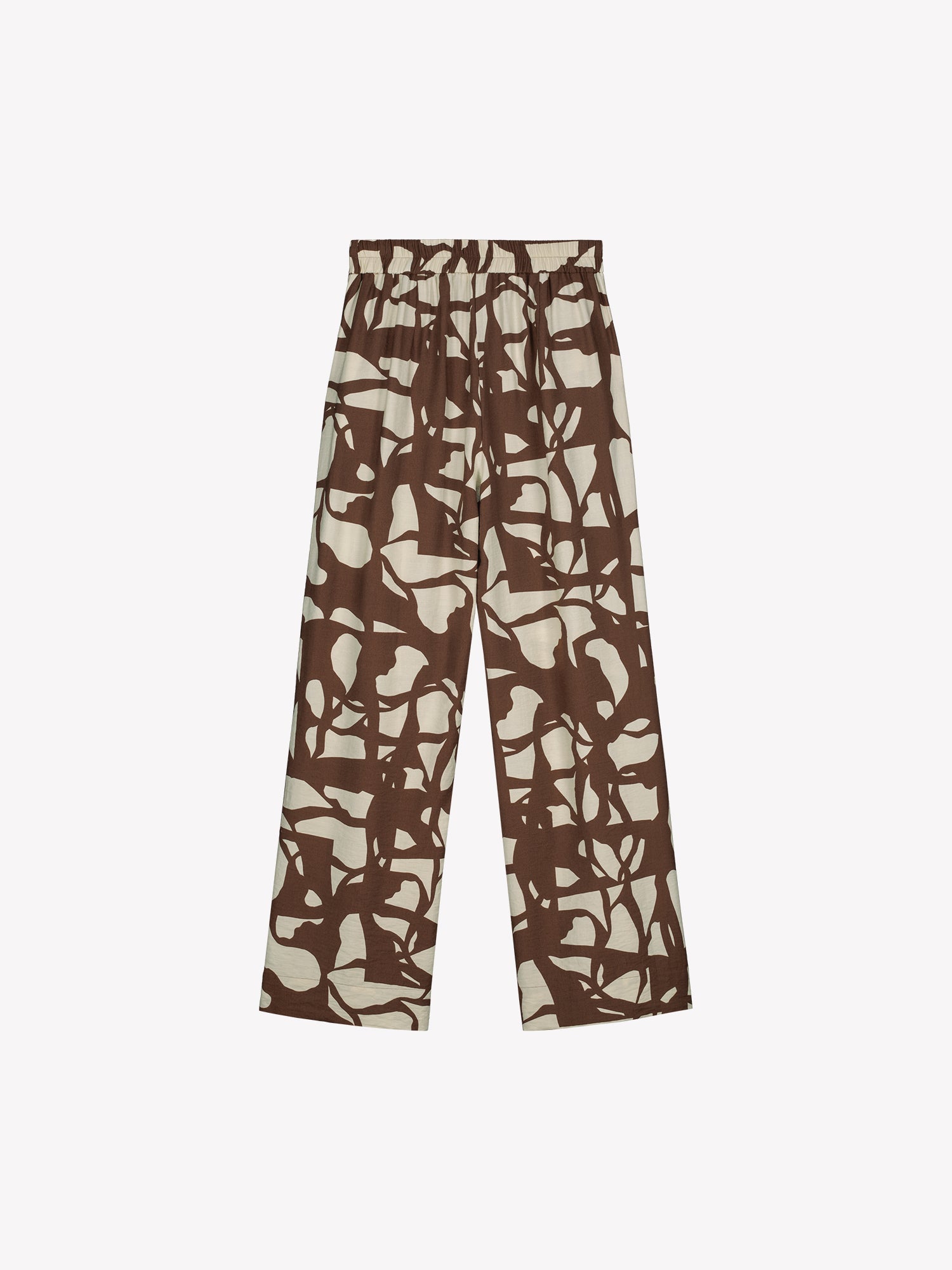 Nanson naisten ihanan rennot ja leveälahkeiset Palsta-housut sivutaskuilla ja tyylikkäällä kaksisävyisellä kuosilla tuotekuvassa takaa päin.