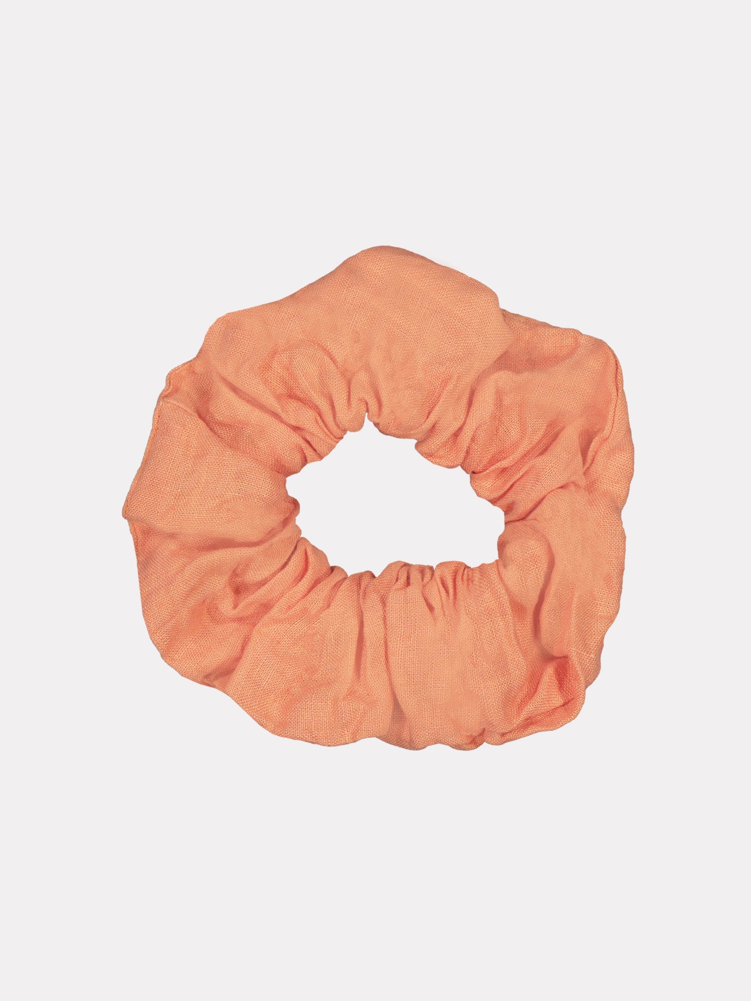 Nanson kaunis ja ajaton oranssi Pellava-hiusdonitsi, joka on valmistettu ylijäämämateriaalista.