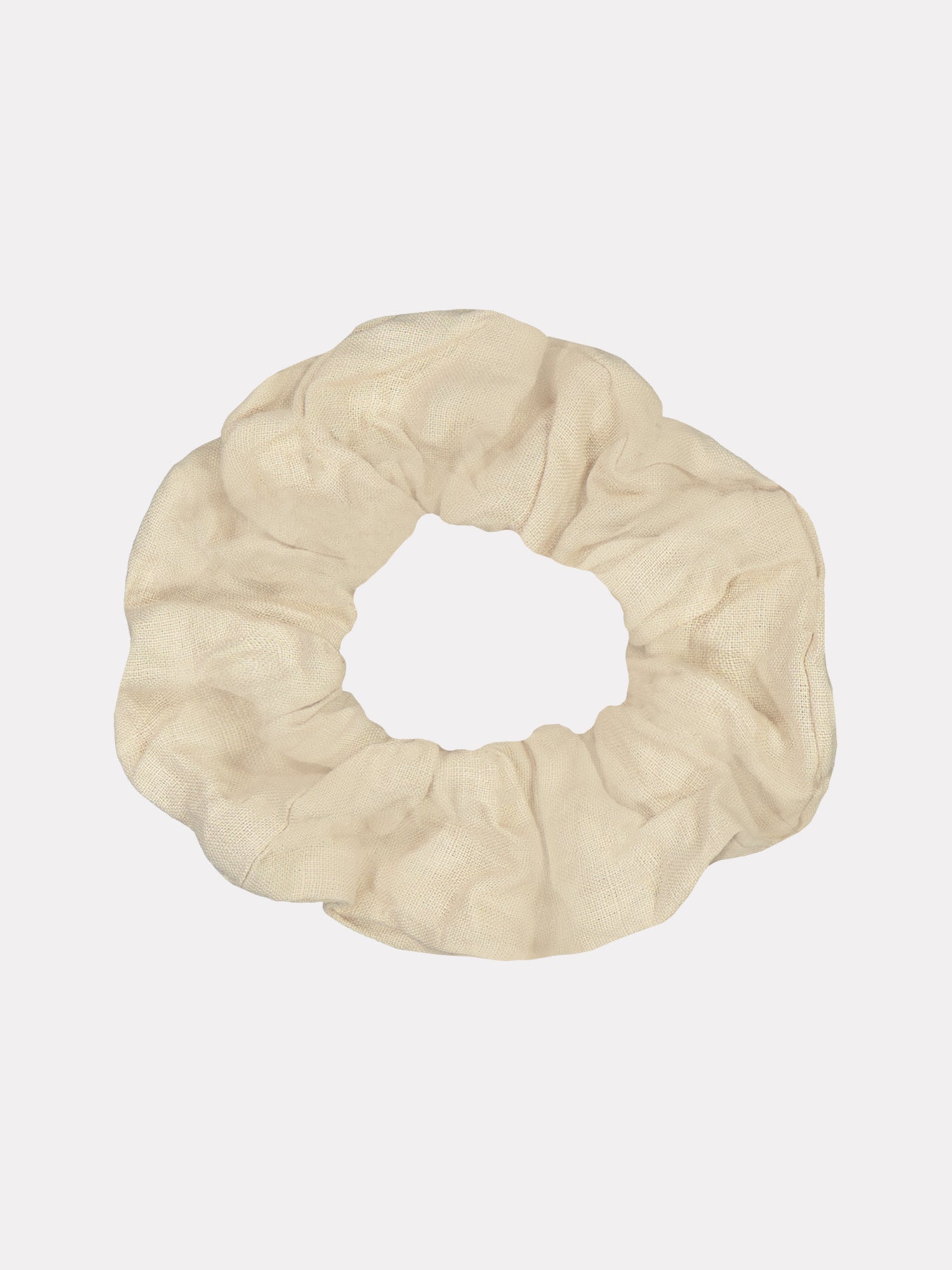 Nanson kaunis ja ajaton beige Pellava-hiusdonitsi, joka on valmistettu ylijäämämateriaalista.